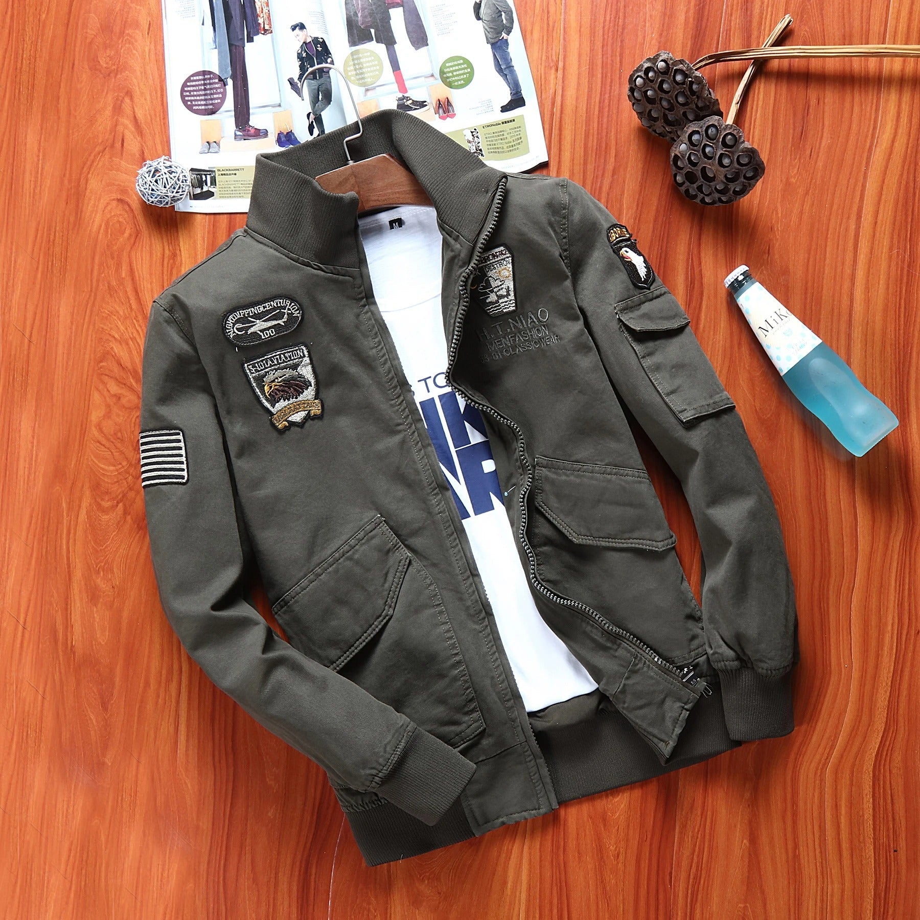 Men's outdoor flight jacket featuring military patches and a stylish design for outdoor adventures