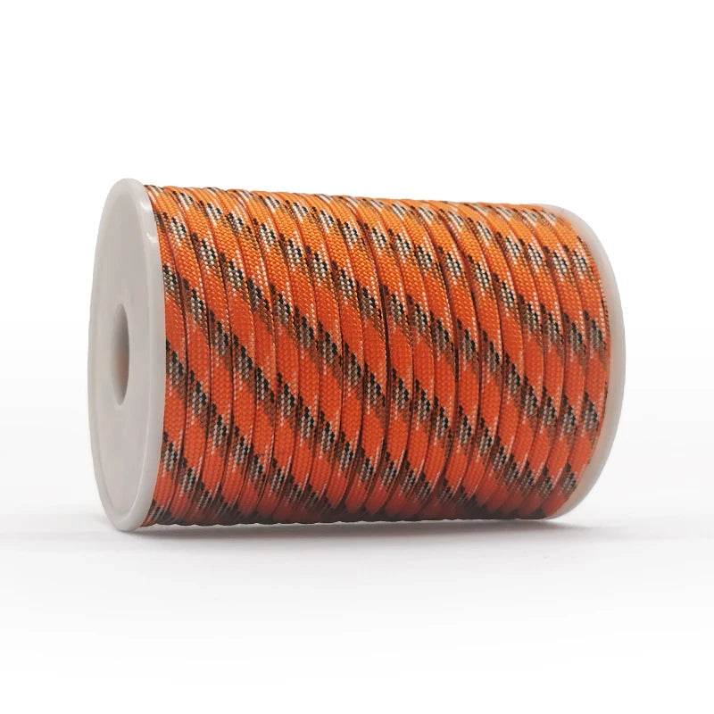 Orange outdoor paracord rope with durable braided design for camping or survival use