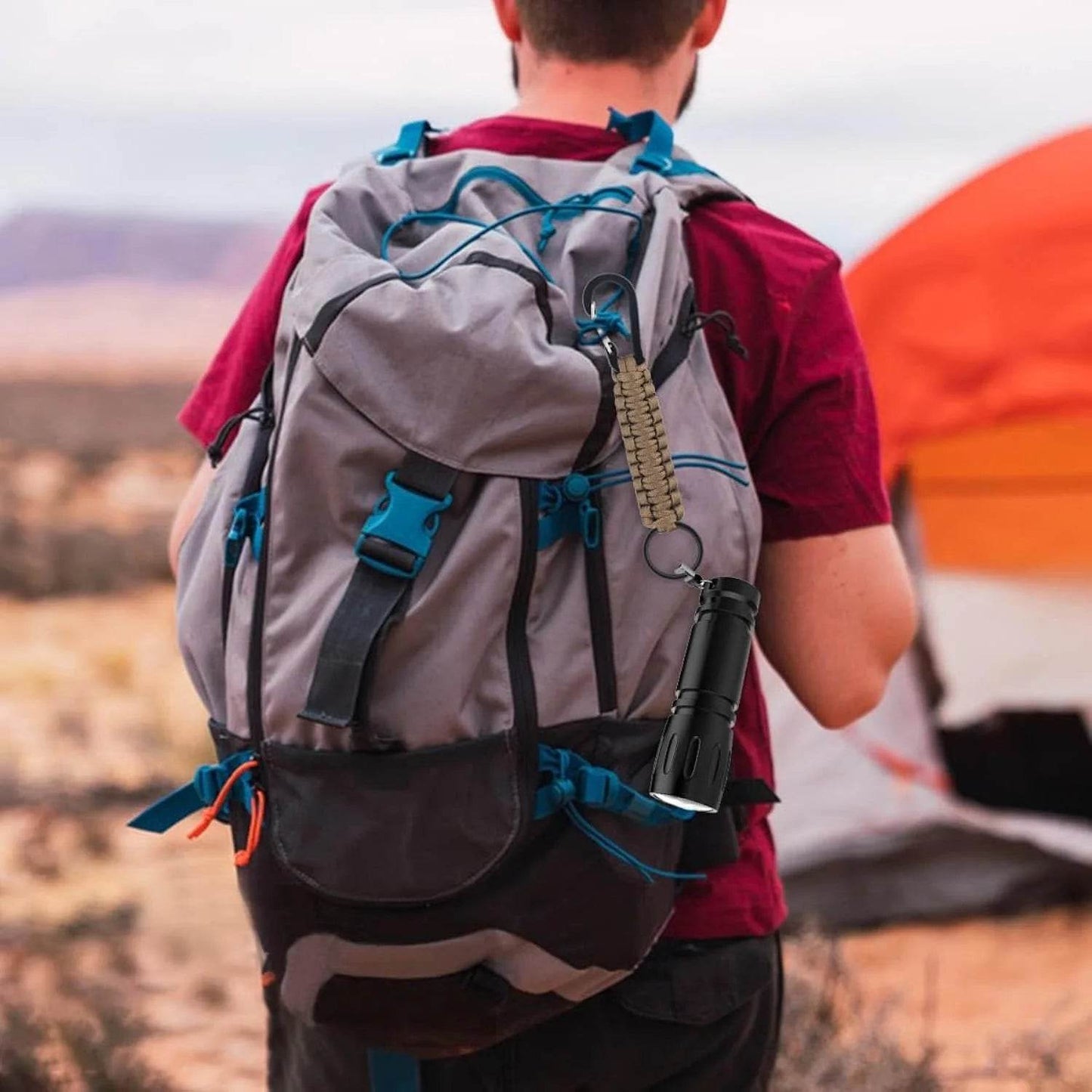 Durable paracord keychain attached to a backpack for outdoor adventures and camping gear