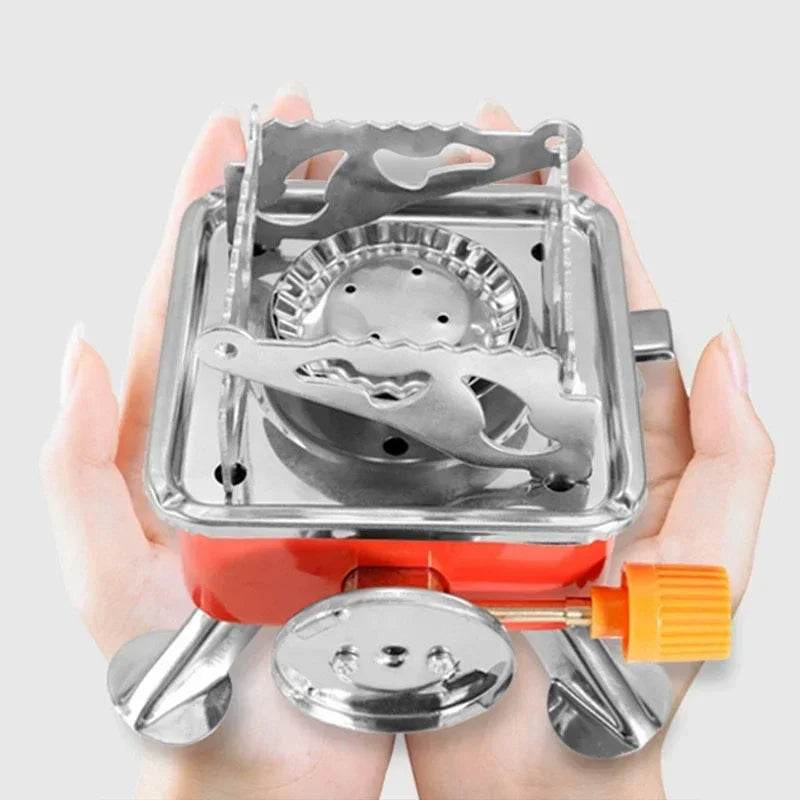 Portable gas stove in red with adjustable flame for outdoor cooking