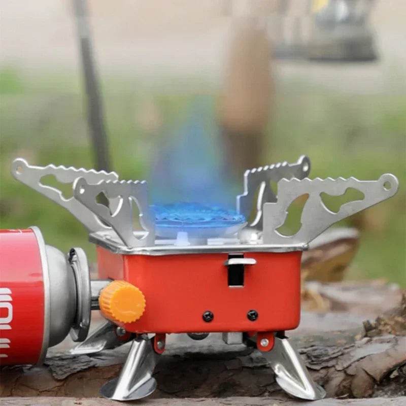 Red portable gas stove with adjustable flame, ideal for camping