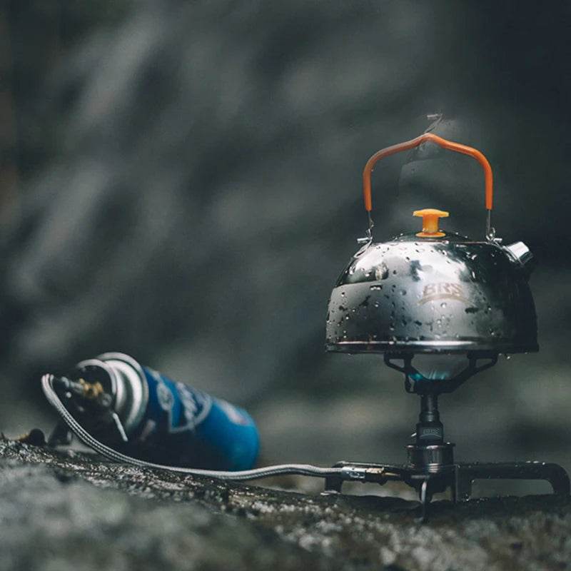 Portable Stove with shiny kettle, ideal for outdoor camping use