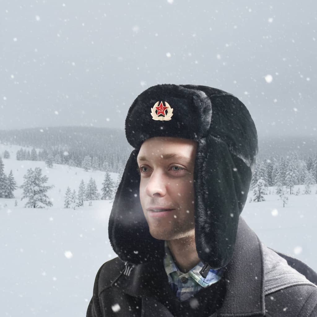 Soviet winter hat in black with ear flaps, ideal for cold weather