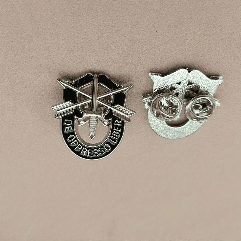 Special Forces pin in silver with intricate military design and motto
