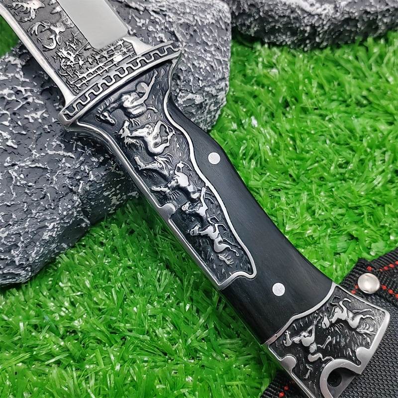 Detailed stainless steel hunting knife with an intricately designed handle and a polished blade