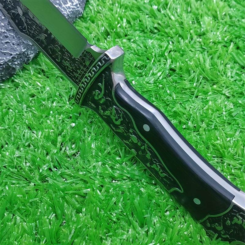 Stainless steel hunting knife with intricate engravings and a stylish black handle
