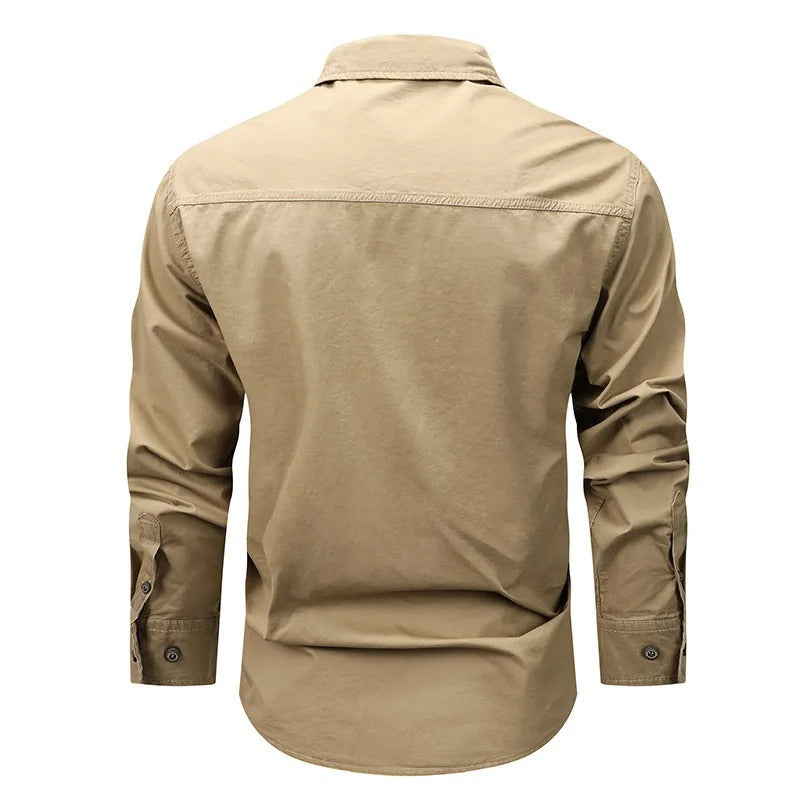Back view of a tactical arm badge shirt in khaki color, designed for outdoor and military use
