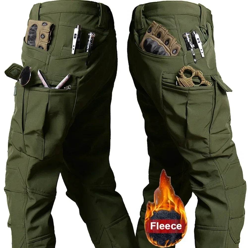 Durable tactical winter pants in olive green with multiple pockets for tools and gear