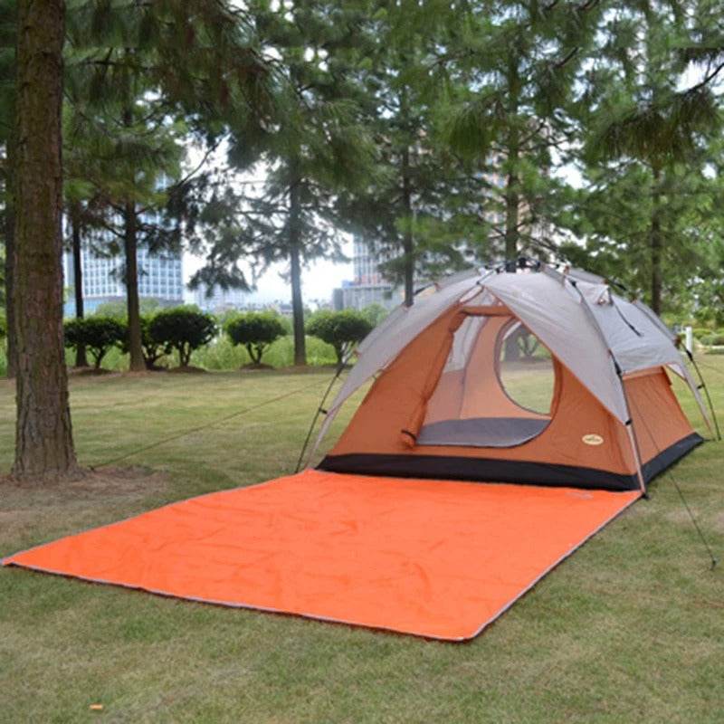 Military tent with orange ground sheet for camping and outdoor adventures