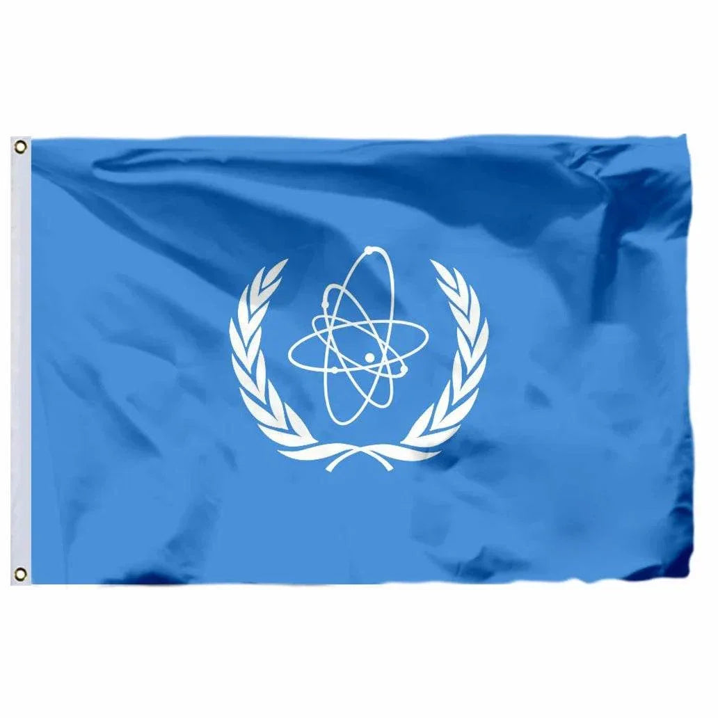 United Nations flag in blue featuring the UN emblem with olive branches and a world map
