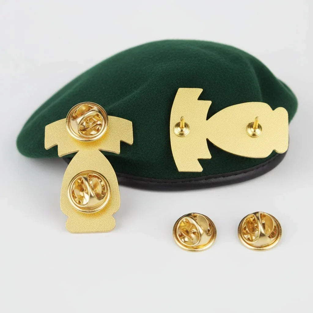 US Army green beret badge gold back clip on a green beret displayed.