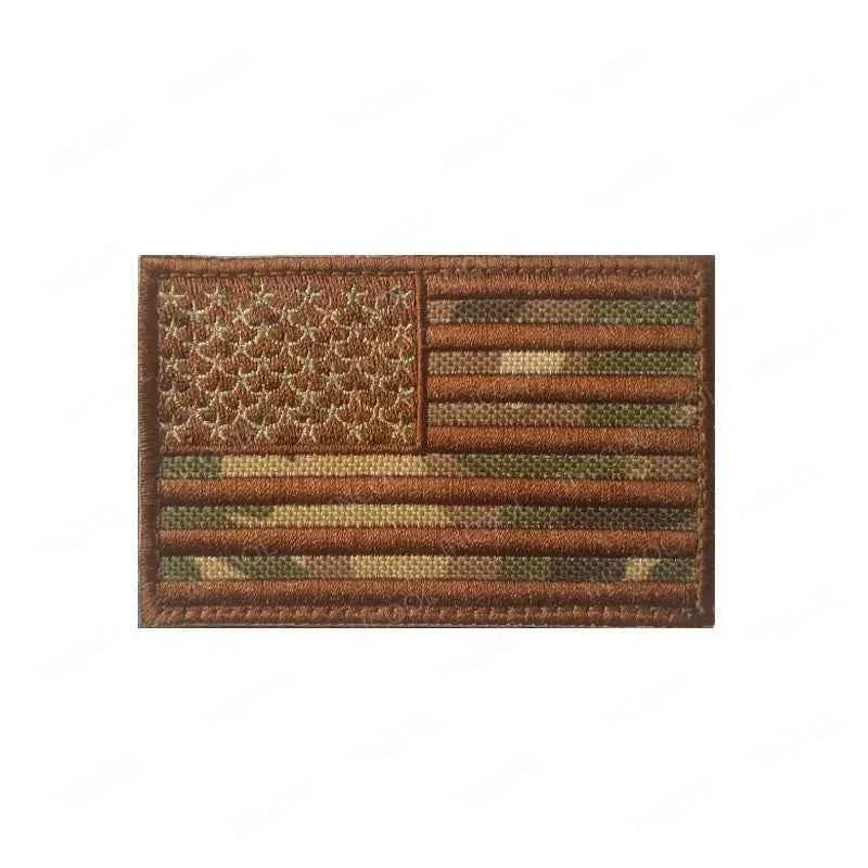 US Flag Embroidered Patch on a Military Camouflage Background for Outdoor Activities