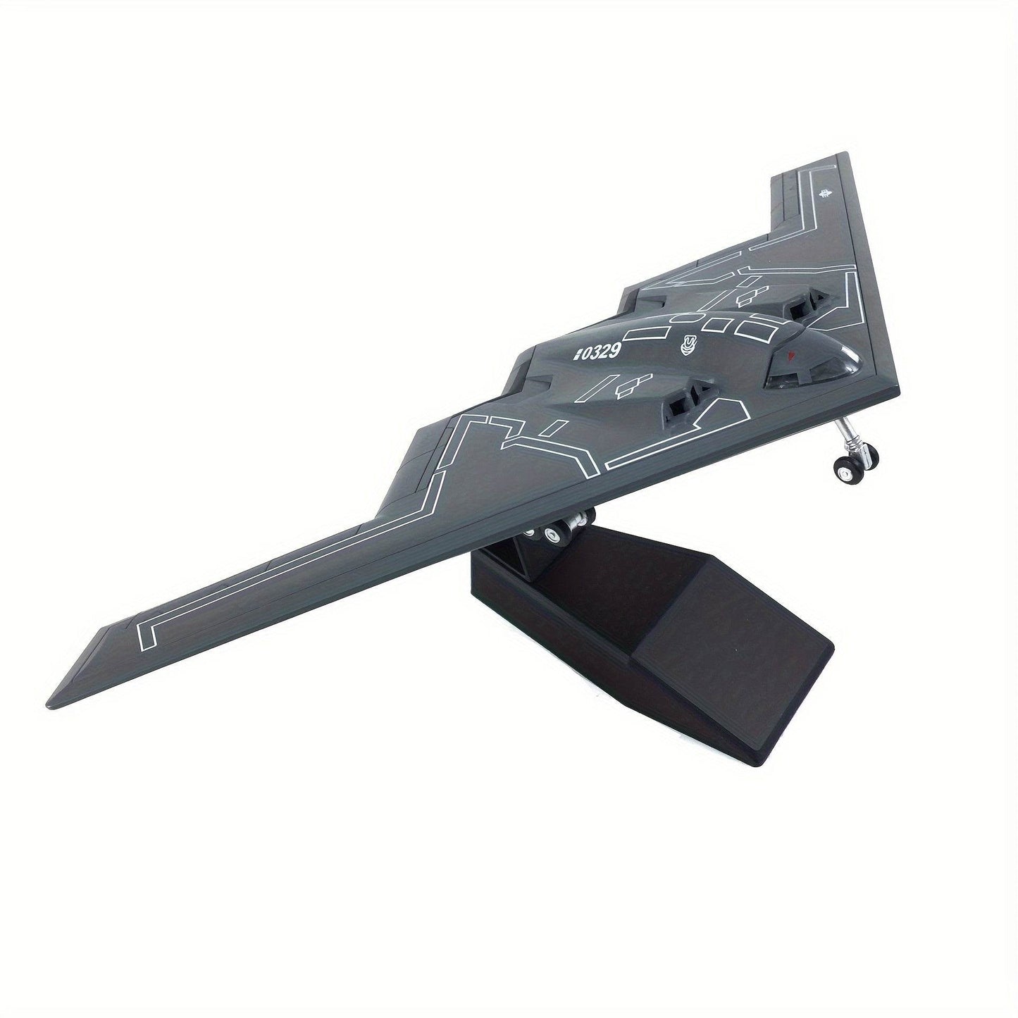 USAF B-2A Spirit model kit displayed on a stand, showcasing its sleek design and intricate details.