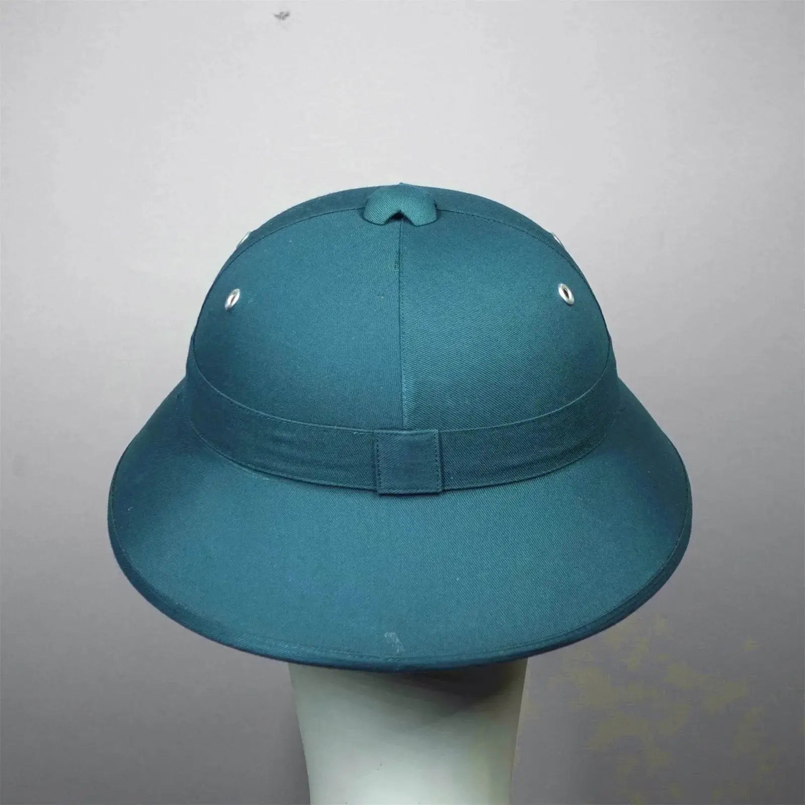 Vietnam surplus military helmet in green, ideal for outdoor activities