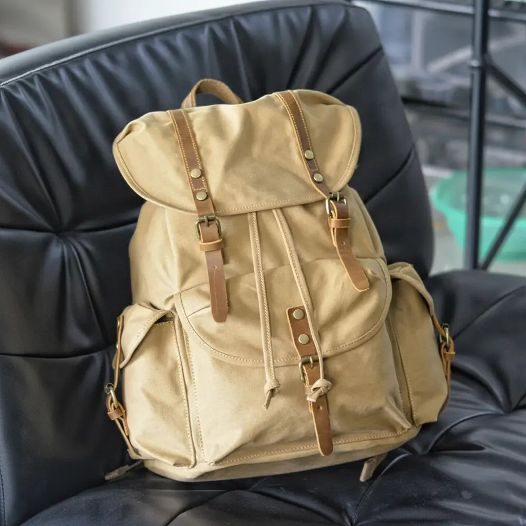 Vintage canvas backpack in khaki color with leather straps for hiking