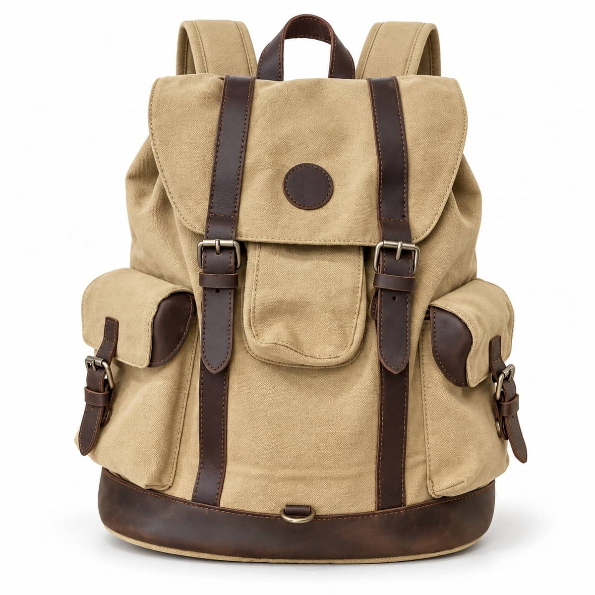 A canvas backpack in tan with dark brown leather straps, trim, and base, shown on a clean white background.