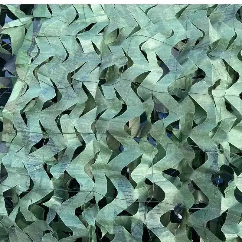 Woodland camouflage netting featuring a leaf-like cut design for effective outdoor concealment
