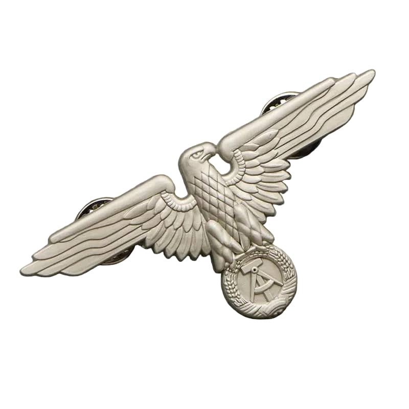 WW2 eagle badge in silver with detailed eagle design for military collectors